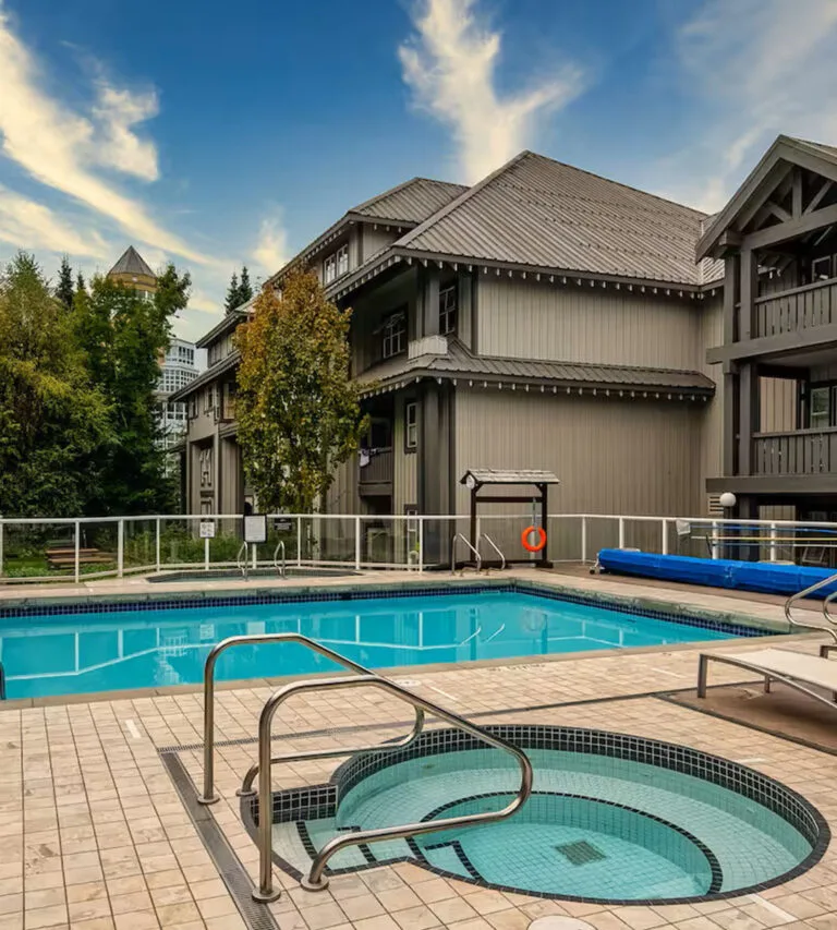 Outdoor pool and hot tub at a Whistler condo complex